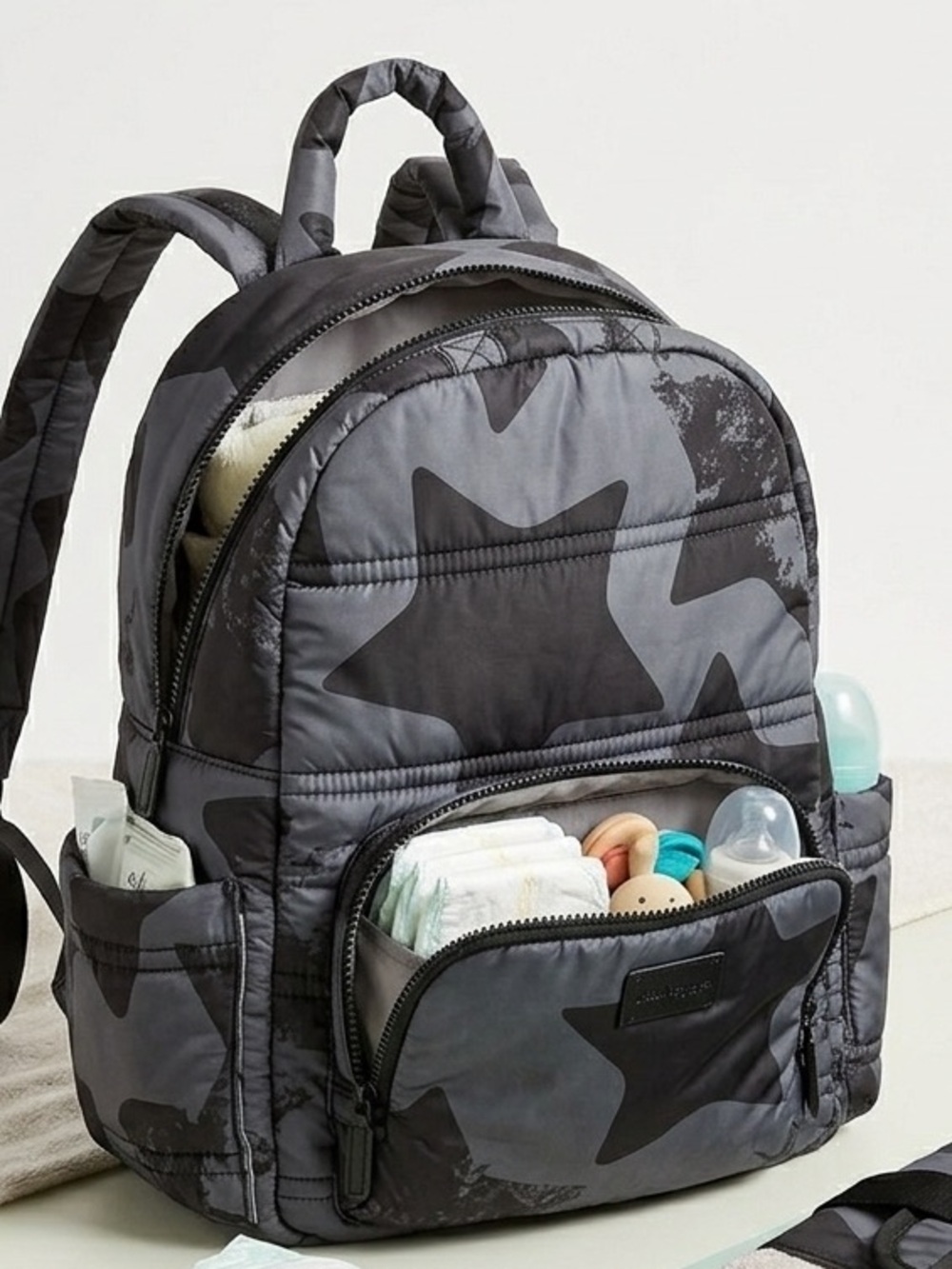 7 AM Enfant Diaper Bag Backpacks with a diaper changing pad